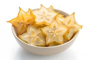 Fototapeta premium Crisp dried starfruit slices showing translucent texture, arranged neatly in bowl, highlighting exotic tropical sweetness and natural fruit beauty.