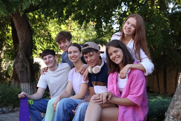 Portrait of happy teenage friends together outdoors
