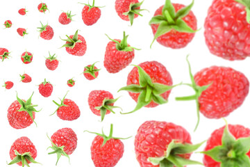 Fresh raspberries swirling in air against white background