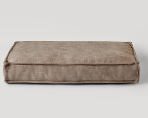 Comfortable brown floor cushion resting on seamless white background