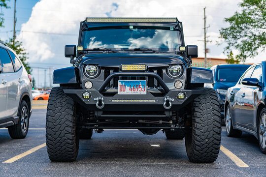 Park Ridge, Illinois, USA - August 17, 2024: Jeep JK SUV. Luxury SUV car of Jeep JK SUV type. Car of Jeep JK parked outdoor. Jeep JK, front view.