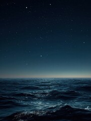 a dark blue ocean with a few stars in the sky