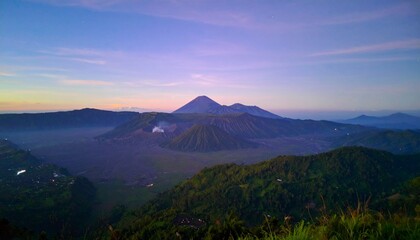 Majestic volcanic landscape at dawn with misty valleys and vibrant sky, evoking adventure and natural beauty.