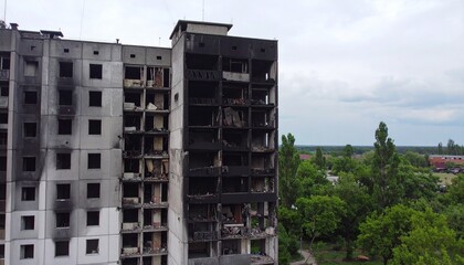Devastated apartment building shows severe damage and destruction from conflict, highlighting urban ruin