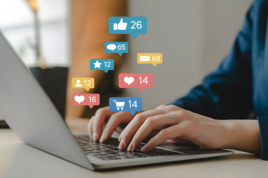 User Engaging with Social Media Interactions and Notifications on Laptop