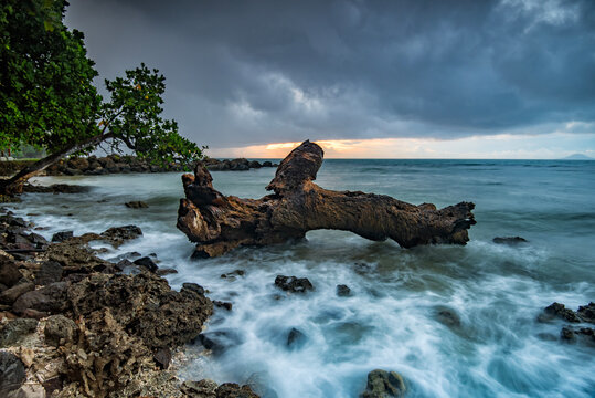 Waves splashing on a rocky coastline, Tanjung Lesung beach, Pandeglang Regency, Banten, Java, Indonesia