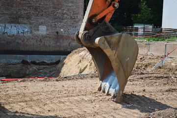 Excavator Bucket on Construction Site: Foundation Work
