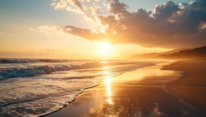 Majestic ocean sunset with golden light, waves and sandy beach scenery