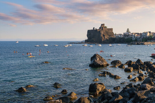 Norman Castle of Aci Castello (Castello Normanno) at sunset, Aci Castello, Sicily, Italy