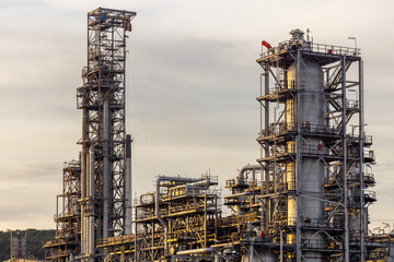 Oil and Gas refinery petrochemical plant industrial on sunset background, Oil and Gas refinery petrochemical plant pipeline steel, Oil and Gas refinery factory maintenance, Global energy refinery.