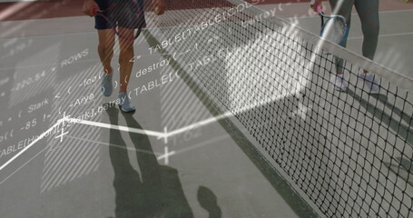Senior couple in sportswear holding rackets on tennis court, with code snippet, wireframe overlays