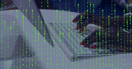 Typing female hands entering code on white keyboard at office workspace, with binary code