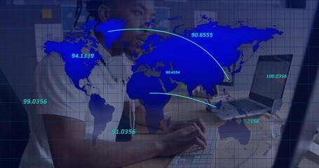 Network engineer analyzing world map overlay in tech workspace, with laptop and headphones