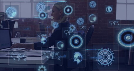 Working woman typing on laptop at office with coffee cup, papers, holographic data maps, copy space