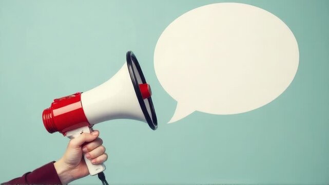 A person holding a red and white megaphone, great for protests or rallies