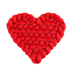 Vibrant red heart made of knitted yarn, symbolizing love and warmth. This handmade textile art piece showcases intricate stitching and cozy texture, perfect for decorations or gifts