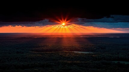 Epic sunset through dark clouds, aerial view of forest