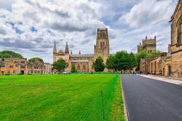 The lawn, grounds, tower and facade of Palace Green at medieval Durham Cathedral on an overcast day in Durham, County Durham, England.