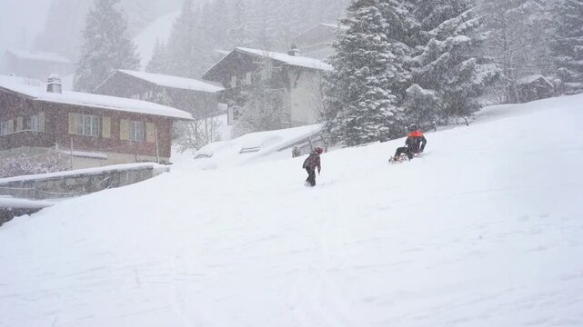 Happy people spending a joyful winter day sledding down snowy alpine hills, surrounded by charming wooden chalets