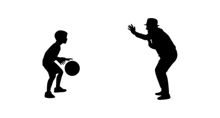 Silhouette image of a young boy and an older coach, positioned side-by-side, during a basketball drill.