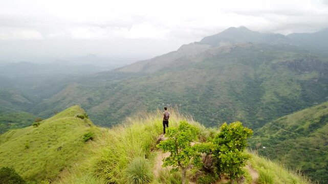Traveler Admiring Mountain Landscape in Ella, Sri Lanka &ndash; Aerial Boomerang Shot