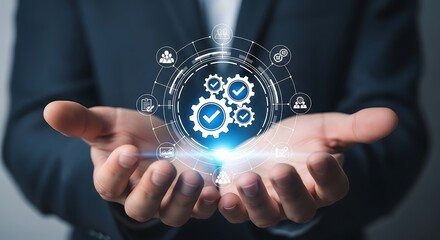 Business process management and quality assurance concept. Man in suit holding a glowing hologram of a standardized workflow system with gears.