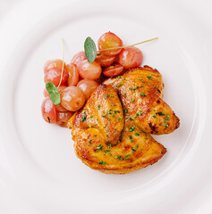 Deliciously roasted chicken breast served with sauteed tomatoes and herbs