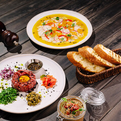 Gourmet culinary experience featuring fresh dishes on rustic wooden table