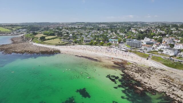 Cliffs over Gyllyngvase Beach and Stack Point from a drone, Falmouth Bay, Falmouth, Cornwall, UK
