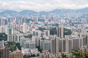 Fototapeta premium View of Hong Kong and Kowloon from Lion Rock Head. Panorama of Hong Kong, skyscrapers and nature.