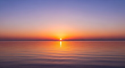 Serene Sunset Over Calm Ocean with Vibrant Sky and Perfect Reflection