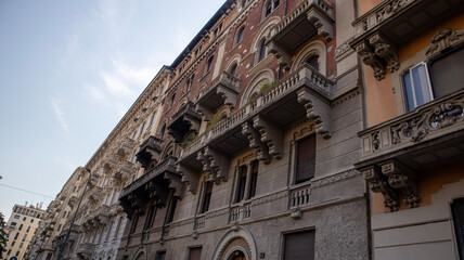Italian Building Facade with Balconies and Shutters