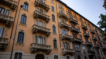 Italian Building Facade with Balconies and Shutters
