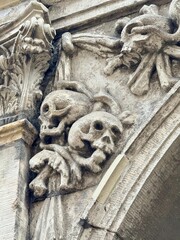 human skulls on the facade of the medieval church