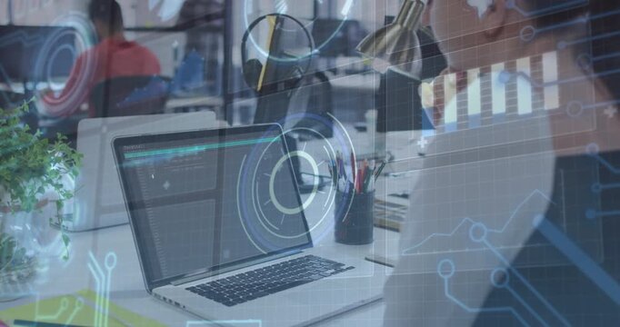 Female worker clicking and reviewing data analytics with animated charts rotating over laptop