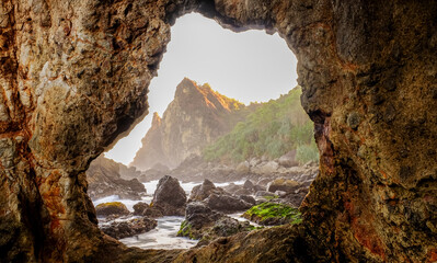 Rocky Seaside Landscape from Cave View during sunset in Yogyakarta