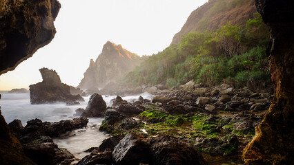 Rocky Seaside Landscape from Cave View during sunset in Yogyakarta, Indonesia