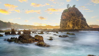 Dramatic Seaside Landscape with Rocks and Sunset in Yogyakarta, Indonesia