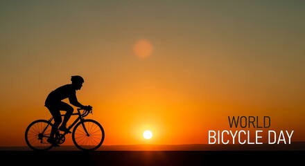 Obraz premium World bicycle day celebration: sunset ride with cyclist silhouette for holiday design and awareness