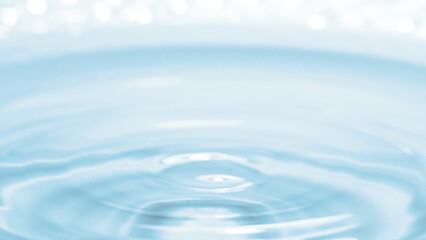 Water Ripple Serenity: A close-up shot showcases the tranquil beauty of concentric water ripples, as a droplet's impact creates gentle waves on the surface, symbolizing purity and calm.
