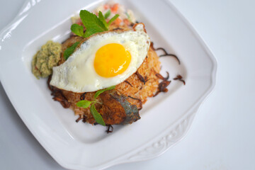 Traditional Biriyani Rice with Egg Omelet Served on White Plate – Isolated Food Photography.