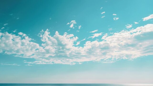 A couple enjoys the sun and surf on a beautiful beach day, with a surfboard lying nearby