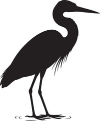 Fototapeta premium Black silhouette of a wading bird standing in shallow water white