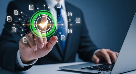 Businessman working on a laptop touches a glowing green checkmark icon. A concept for digital document approval and quality assurance system.