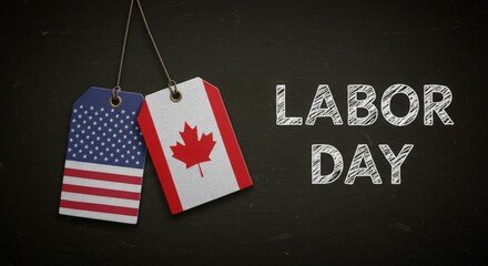 Labor day celebration with american and canadian flags on tags against a dark chalkboard background