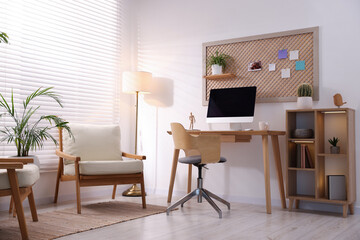Stylish workplace with wooden desk and computer at home office. Interior design
