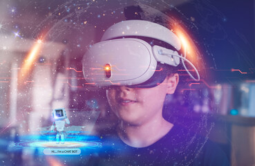 Teen boy wearing virtual reality headset and looking at digital space system with planets or Universes.Young boy learning with Ai chat bot about Space exploration with augmented reality glasses