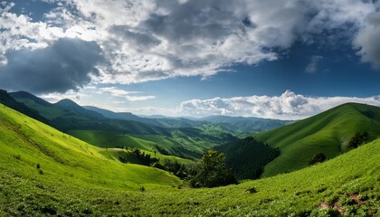 Obraz premium panoramic view of lush green hills and valleys under a cloudy sky