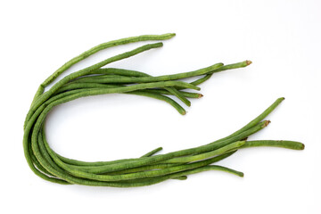 Yardlong beans isolated on white background. They are a good source of vitamins A, C, and K, as well as minerals like folate, magnesium, iron, and potassium.