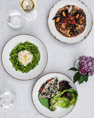 Indulge in gourmet seafood and colorful vegetable dishes served on